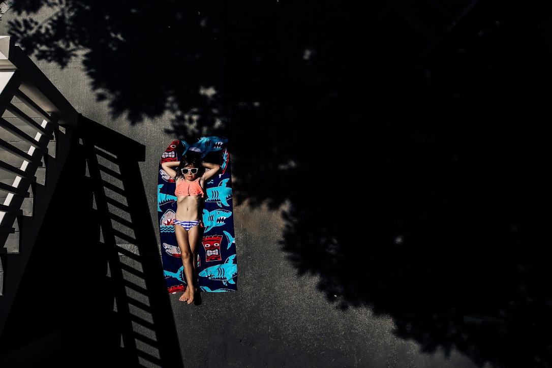 girl sunbathing summer shade backyard