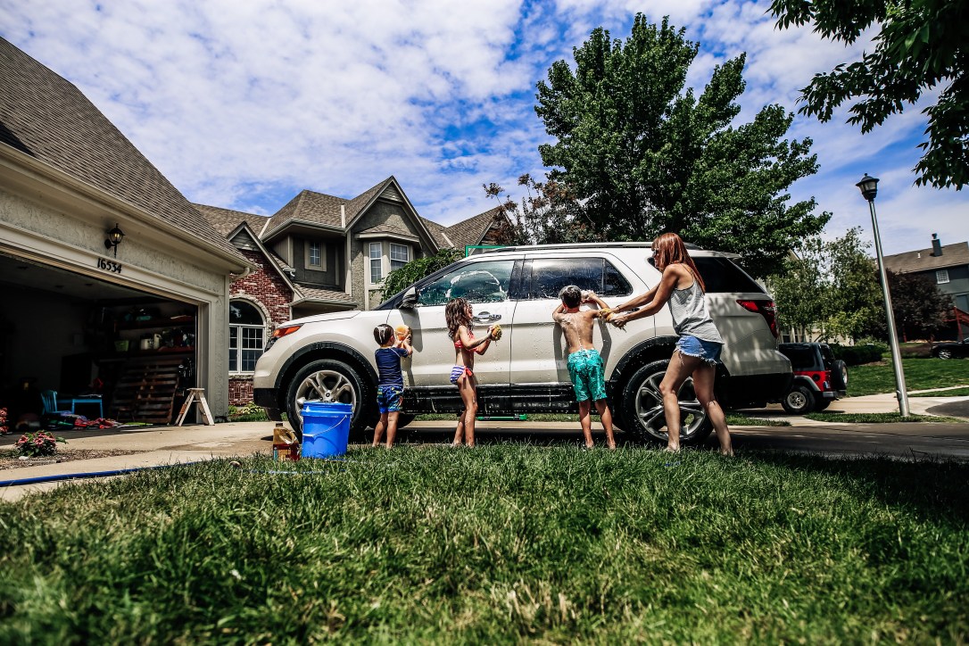 washing car driveway self portrait motherhood children summertime joy