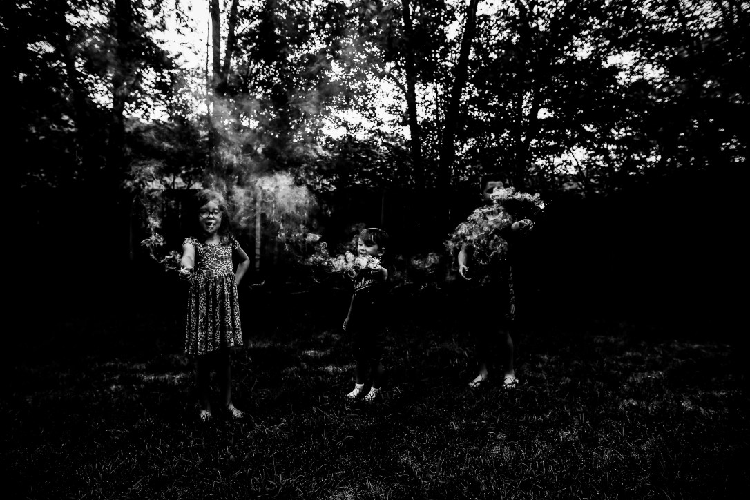 children sparklers summer kansas city black and white