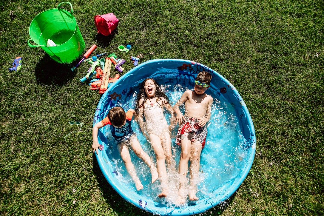 Summer backyard pool kids joy kansas city water squirt guns splash