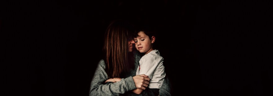 self portrait mother son low light snuggle
