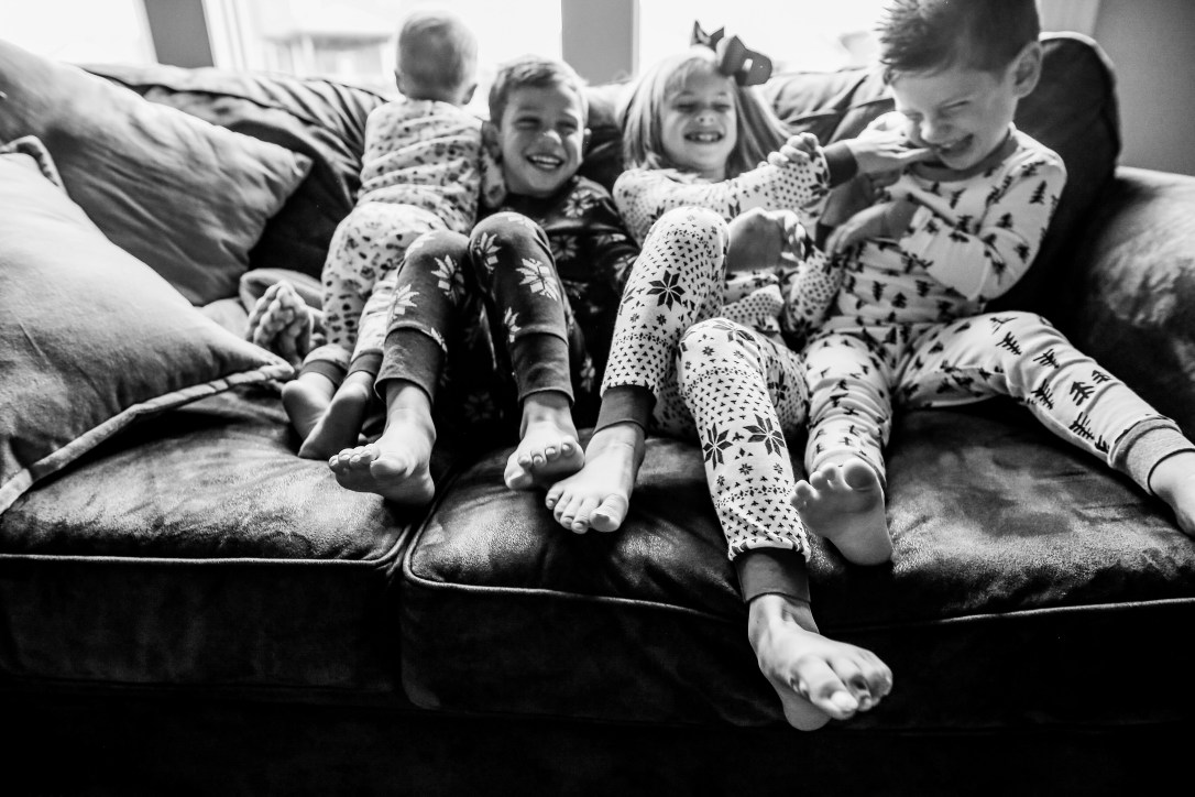 family photography kids laughing matching jammies christmas