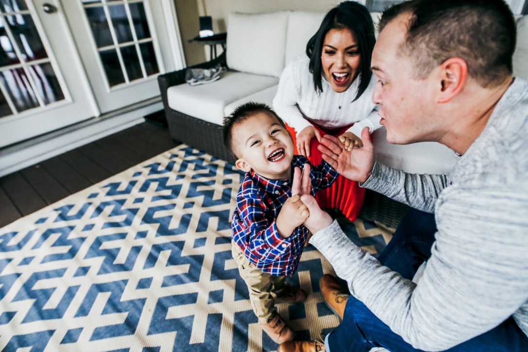 family photography laughing at home session toddler boy