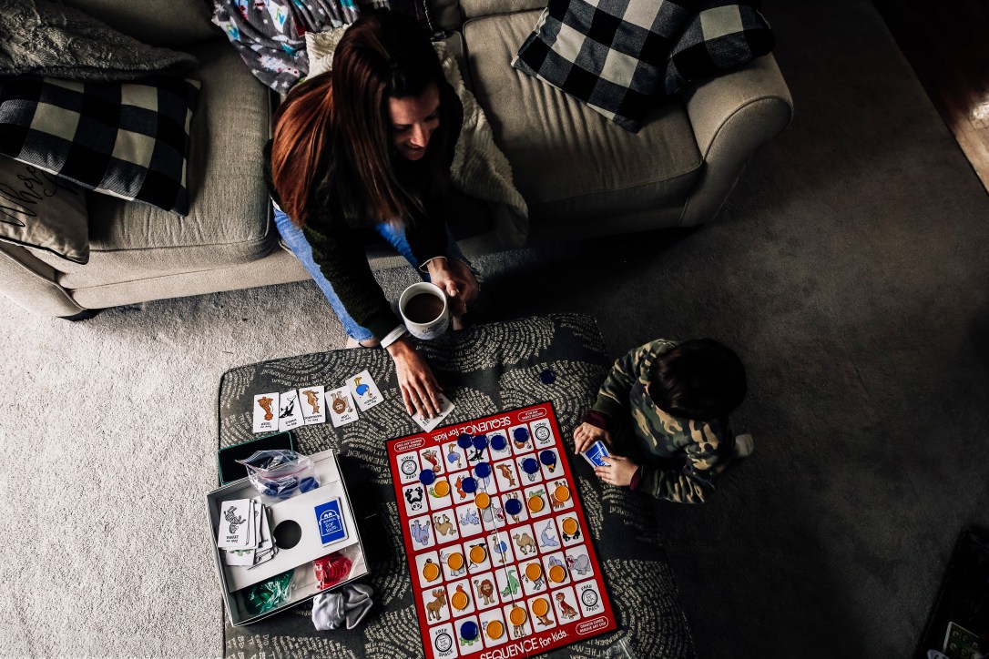 mom and son playing board game