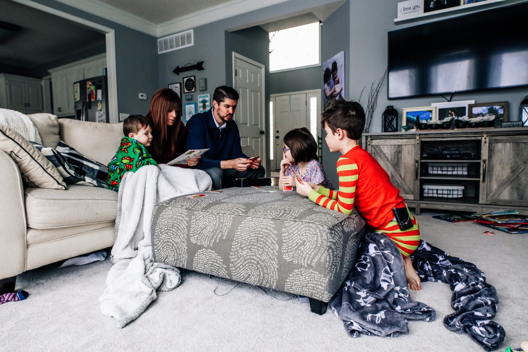 Family game night family playing card game kids mom dad