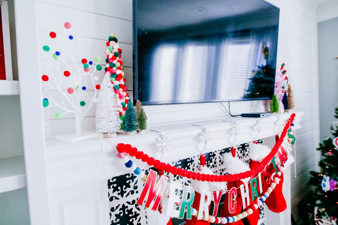 Christmas mantel holiday decor pom pom trees multi colored stockings DIY