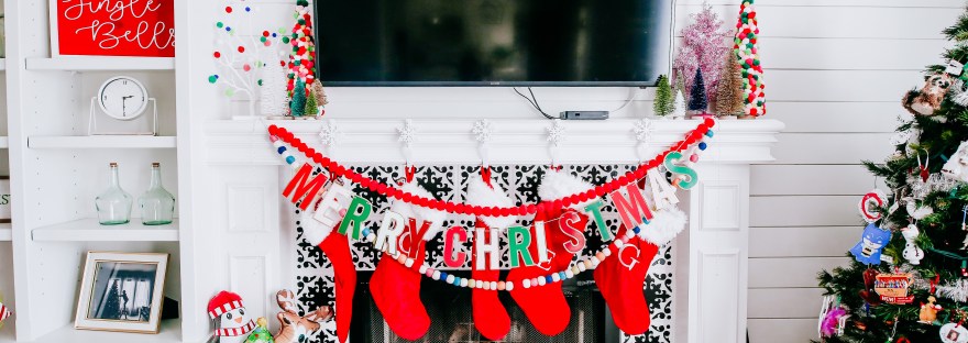 Christmas mantel holiday decor pom pom trees multi colored stockings